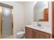 Cozy bathroom with a shower, toilet and vanity with decorative mirror at 2640 Sw 36Th Ln, Ocala, FL 34471