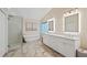 Stunning bathroom featuring a glass shower, soaking tub, double vanity and stylish fixtures at 2640 Sw 36Th Ln, Ocala, FL 34471