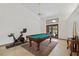 Spacious game room with a pool table and an exercise bike at 2640 Sw 36Th Ln, Ocala, FL 34471
