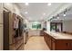 Bright kitchen with stainless steel appliances, granite countertops, custom cabinetry, and a large island with seating at 2640 Sw 36Th Ln, Ocala, FL 34471