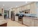 Well-lit kitchen with stainless steel appliances, granite countertops, and plentiful cabinet storage at 2640 Sw 36Th Ln, Ocala, FL 34471