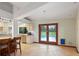 Bright, open kitchen flows to the pool area, showcasing granite countertops, stainless appliances, and tile floors at 2640 Sw 36Th Ln, Ocala, FL 34471