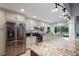 Modern kitchen featuring stainless steel appliances, granite countertops, ample cabinet space, and a large island at 2640 Sw 36Th Ln, Ocala, FL 34471
