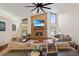 Spacious living room with a brick fireplace and vaulted ceilings, creating a bright and airy atmosphere at 2640 Sw 36Th Ln, Ocala, FL 34471