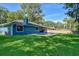 Lush green yard featuring a well maintained lawn and refreshing pool at 2855 Se 38Th St, Ocala, FL 34480