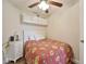Small bedroom with white furniture including twin bed, drawers, and ceiling fan at 2855 Se 38Th St, Ocala, FL 34480