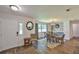 Dining area with natural light, decorative light fixture, and ample seating adjacent to the front door at 2855 Se 38Th St, Ocala, FL 34480