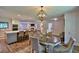 Open concept Dining room with a view into the kitchen and living spaces with great lighting and modern finishes at 2855 Se 38Th St, Ocala, FL 34480
