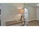 Hallway with console table, lamp, and decorative sign, with doorway views at 2855 Se 38Th St, Ocala, FL 34480