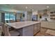 Open kitchen featuring an island, modern stainless steel appliances, and plenty of cabinet space at 2855 Se 38Th St, Ocala, FL 34480
