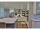 Well-lit kitchen with stainless steel appliances, granite countertops, and updated cabinets at 2855 Se 38Th St, Ocala, FL 34480
