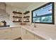 Bright kitchen featuring modern finishes, stainless steel appliances, and stylish shelving at 2855 Se 38Th St, Ocala, FL 34480