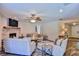 Open living area with wood flooring, brick fireplace, and comfortable seating at 2855 Se 38Th St, Ocala, FL 34480