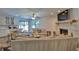 Open-concept living room with fireplace and sliding glass doors to outdoor area at 2855 Se 38Th St, Ocala, FL 34480