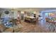 Spacious open concept kitchen, dining and living area featuring updated floors, a large island, and stainless appliances at 2855 Se 38Th St, Ocala, FL 34480