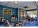 Inviting outdoor patio with ample seating, ceiling fan, and stylish decor and a grill at 2855 Se 38Th St, Ocala, FL 34480