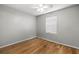Empty bedroom featuring hardwood floor, fan and window at 329 Larch Rd, Ocala, FL 34480