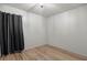 Empty bedroom featuring hardwood floor and curtains at 329 Larch Rd, Ocala, FL 34480