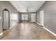 Spacious open-concept living room showcasing hardwood floors, natural light and neutral color palette at 329 Larch Rd, Ocala, FL 34480