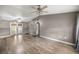 Inviting living room featuring hardwood floors, ceiling fans, and natural light at 329 Larch Rd, Ocala, FL 34480