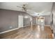 Bright and airy living room highlighting hardwood floors, neutral wall paint, and open design at 329 Larch Rd, Ocala, FL 34480