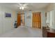 Neutral bedroom showcasing closet with louvered doors, carpet, and neutral paint at 3427 Se 137Th St, Summerfield, FL 34491