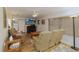 Inviting living room with hardwood flooring, ceiling fan, and a fireplace at 3427 Se 137Th St, Summerfield, FL 34491