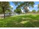 Picture of a sprawling backyard with mature trees and ample space for recreation at 3883 Se 51St Ct, Ocala, FL 34480