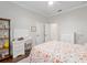 Bedroom with a comfortable bed, a desk, and ample storage; features a ceiling fan at 3883 Se 51St Ct, Ocala, FL 34480