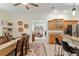 Open floorplan with dining table, kitchen island, and bar seating for entertaining at 3883 Se 51St Ct, Ocala, FL 34480