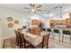 View of the dining area flowing into the kitchen, creating a seamless and social space at 3883 Se 51St Ct, Ocala, FL 34480