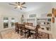 Inviting dining room with a large table, stylish rug, and built-in shelving for decor at 3883 Se 51St Ct, Ocala, FL 34480