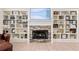 Close-up of the stone fireplace surrounded by built-in bookshelves, adding charm and character at 3883 Se 51St Ct, Ocala, FL 34480