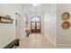 Inviting foyer with tile flooring and a view of the front doors at 3883 Se 51St Ct, Ocala, FL 34480