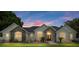 Well-maintained home with stone accents and beautifully landscaped front yard at 3883 Se 51St Ct, Ocala, FL 34480