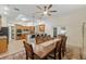 Bright kitchen and dining area with stainless steel appliances, granite countertops, and modern lighting at 3883 Se 51St Ct, Ocala, FL 34480