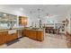 Spacious kitchen featuring granite countertops, stainless steel appliances, and an open dining area at 3883 Se 51St Ct, Ocala, FL 34480