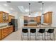 Beautiful kitchen with custom cabinetry, granite counters, and a functional breakfast bar at 3883 Se 51St Ct, Ocala, FL 34480
