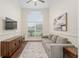 Bright living room with a large window, comfortable seating, and hardwood floors at 3883 Se 51St Ct, Ocala, FL 34480
