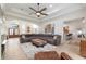 Open-concept living room with a view of the entry, kitchen, and dining area at 3883 Se 51St Ct, Ocala, FL 34480
