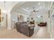 Spacious living room with tray ceiling, tile floors, and comfortable seating at 3883 Se 51St Ct, Ocala, FL 34480