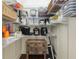 Organized pantry with shelving, small appliances, storage containers, and a wood cabinet at 3883 Se 51St Ct, Ocala, FL 34480