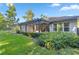 Beautiful backyard with patio, pergola, green grass, and mature landscaping at 3993 Se 10Th Ave, Ocala, FL 34480