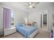 Comfortable bedroom with a twin bed, neutral walls, and lots of natural light at 3993 Se 10Th Ave, Ocala, FL 34480