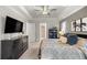 Spacious main bedroom boasts a decorative ceiling, dark wood dresser, and a lovely view at 3993 Se 10Th Ave, Ocala, FL 34480