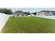 Large, fenced backyard with lawn, brick patio, and screened in porch at 4531 Se 27Th St, Ocala, FL 34480