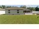 A spacious backyard features a brick patio, fire pit, and white vinyl privacy fence at 4531 Se 27Th St, Ocala, FL 34480