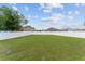 The home features a large, green backyard surrounded by a white privacy fence at 4531 Se 27Th St, Ocala, FL 34480