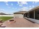 View of a brick patio with a cozy firepit, perfect for outdoor gatherings at 4531 Se 27Th St, Ocala, FL 34480