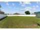 Wide backyard with green lawn and white fence at 4531 Se 27Th St, Ocala, FL 34480